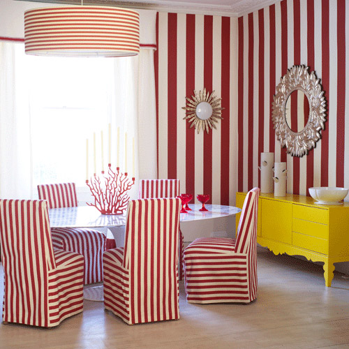 quirky red white stripe dining room yellow sideboard round mirror drum shade